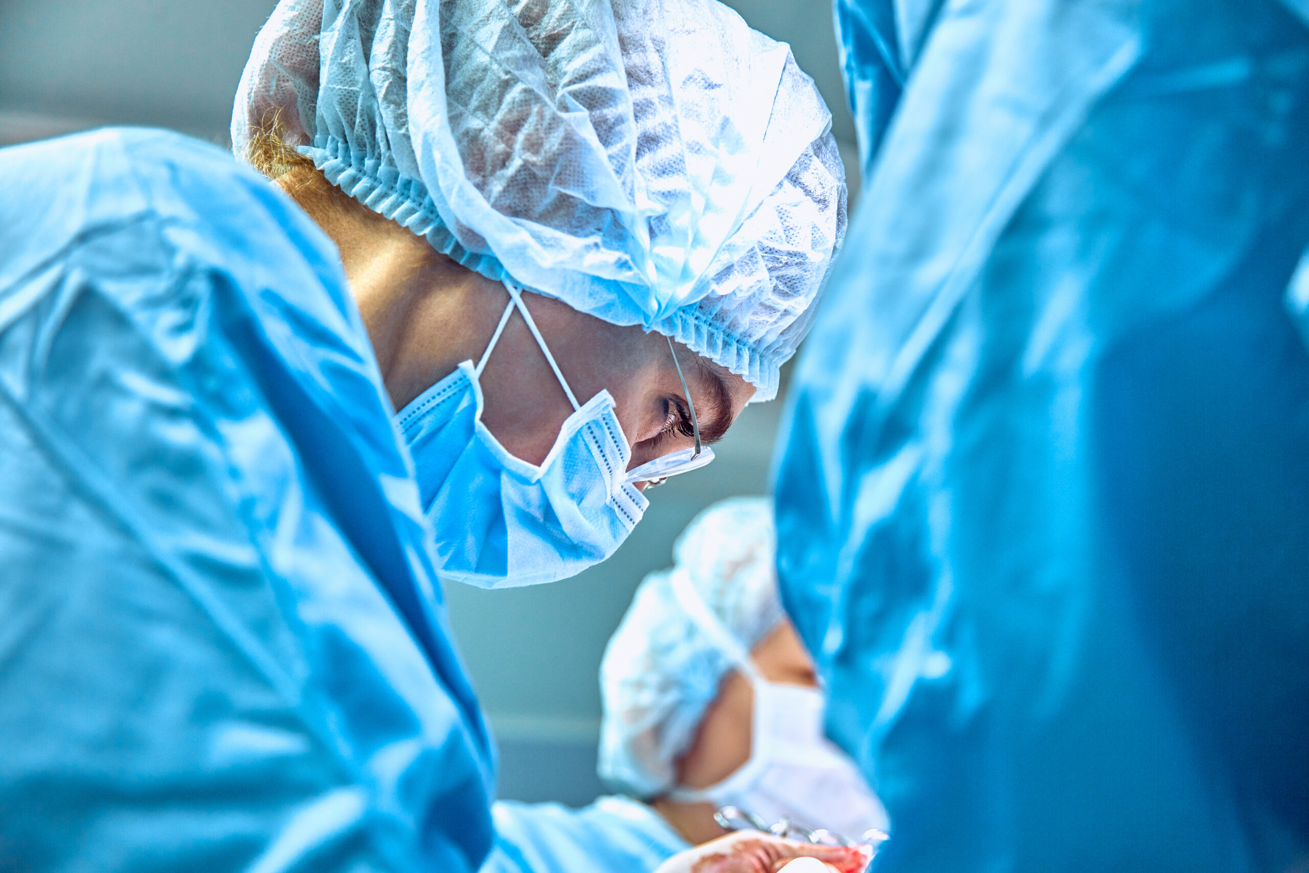 Close,Up,Portrait,Of,Young,Female,Surgeon,Doctor,Wearing,Protective